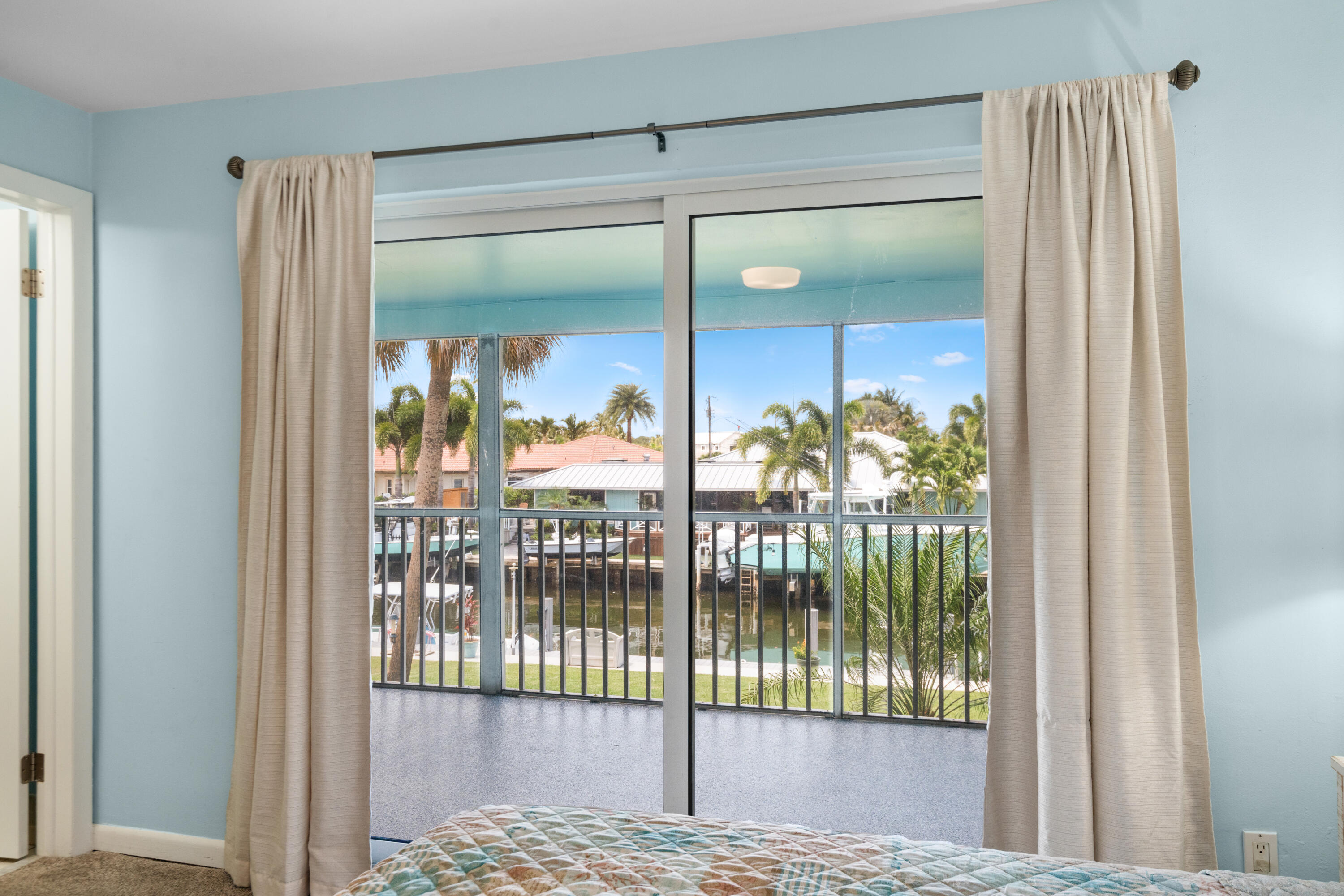 249 Center Street, Unit 2C Jupiter, FL 33458 - Photo 19 of 29 a view of a glass door with a glass window