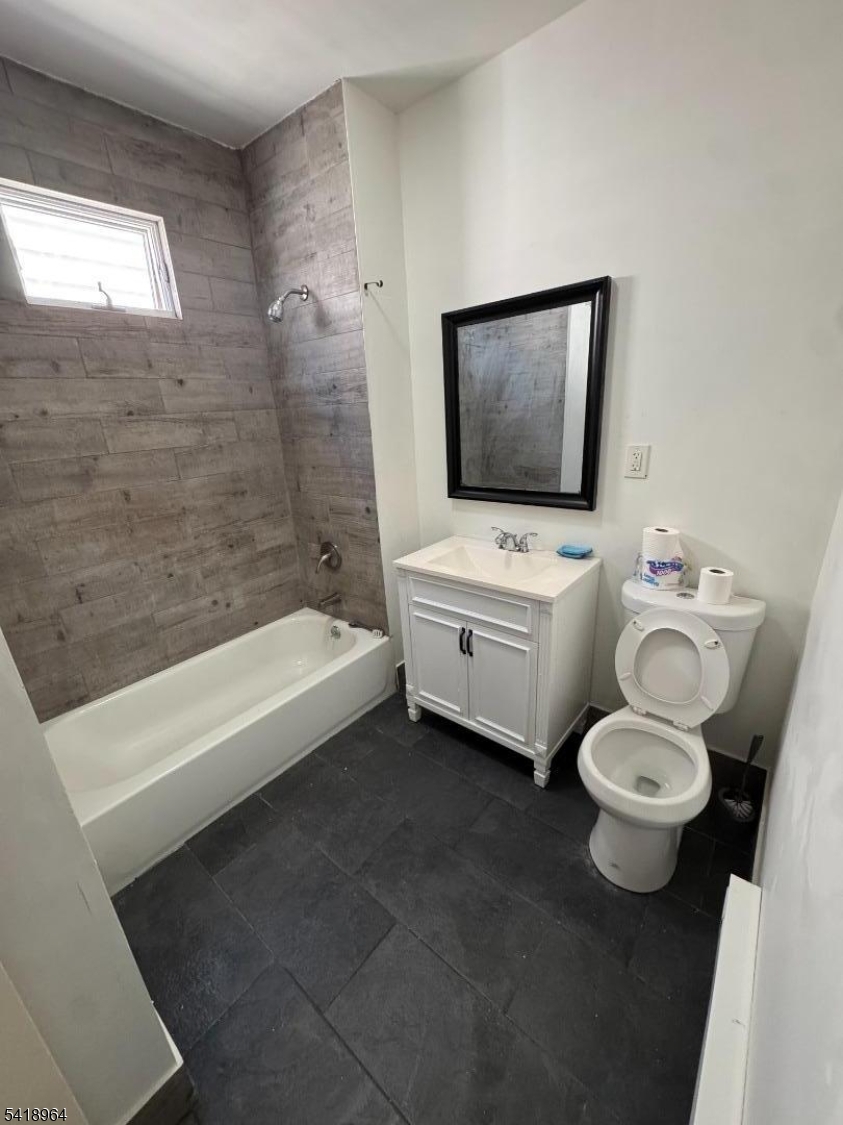 149 Brookside Avenue, Unit 2 Irvington, NJ 07111 - Photo 1 of 8 a bathroom with a toilet a sink and bathtub