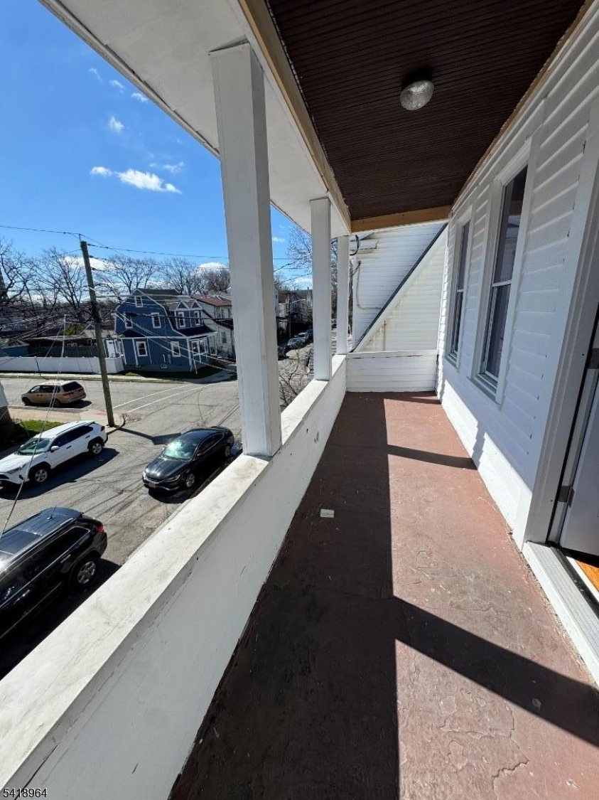 149 Brookside Avenue, Unit 2 Irvington, NJ 07111 - Photo 4 of 8 a view of a balcony with an outdoor space