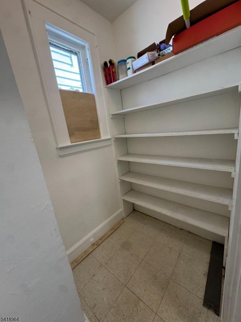 149 Brookside Avenue, Unit 2 Irvington, NJ 07111 - Photo 5 of 8 a view of closet area with empty racks