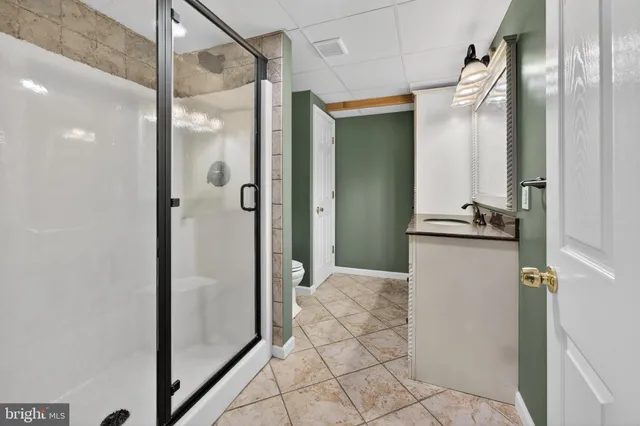 a view of a bathroom with mirror