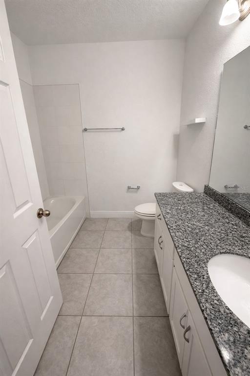 2237 Shadowland Loop Winter Park, FL 32792 - Photo 16 of 20 a bathroom with a granite countertop sink and a mirror