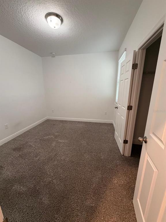 2237 Shadowland Loop Winter Park, FL 32792 - Photo 17 of 20 an empty room with a fireplace