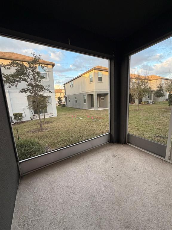2237 Shadowland Loop Winter Park, FL 32792 - Photo 8 of 20 a view of an empty room with a floor to ceiling window next to a yard