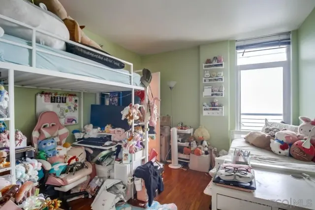 a bathroom with a granite countertop sink toilet and a mirror
