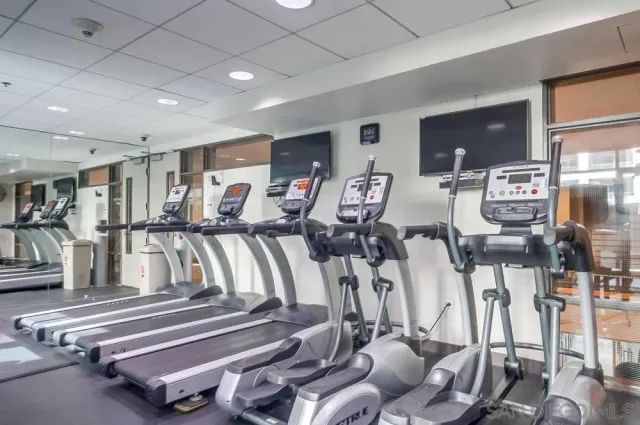 a view of a patio with table and chairs