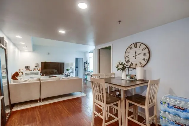 a kitchen with stainless steel appliances a refrigerator and a table