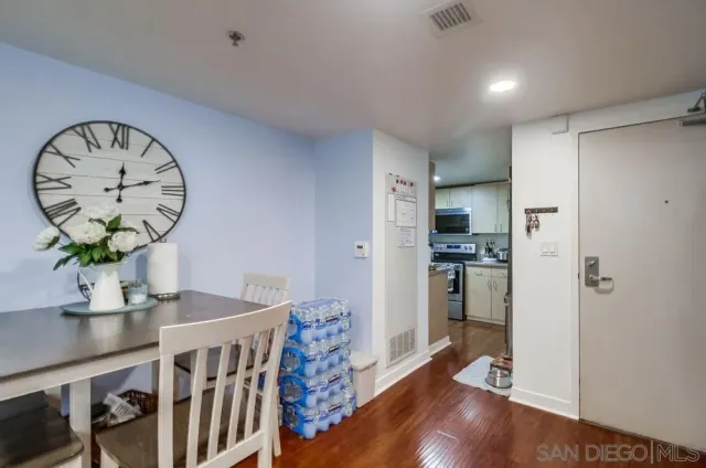 a kitchen with stainless steel appliances granite countertop a refrigerator sink and stove top oven