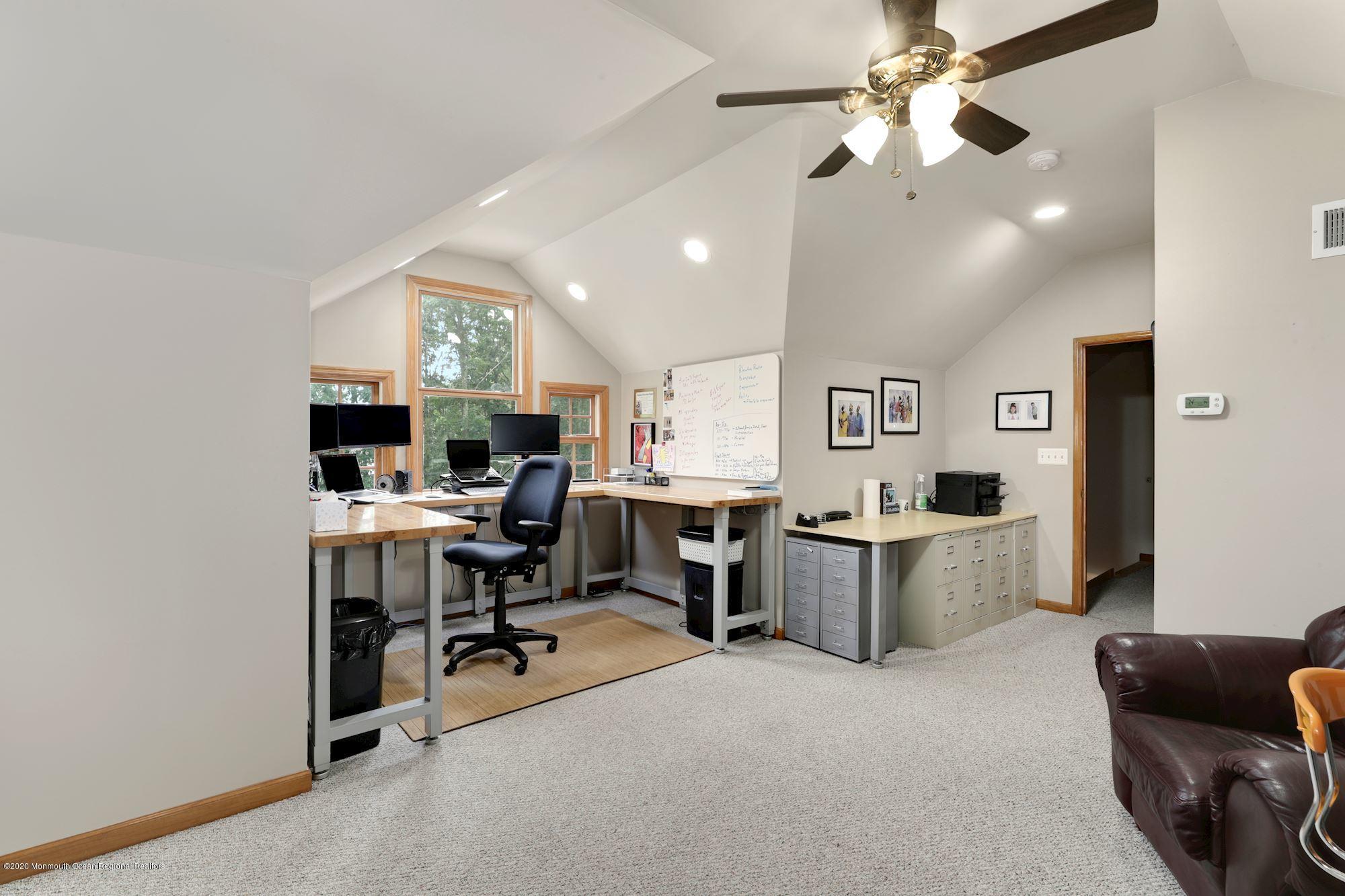 782 Harmony Road Jackson, NJ 08527 - Photo 3 of 25 a view of a livingroom with workspace and a window