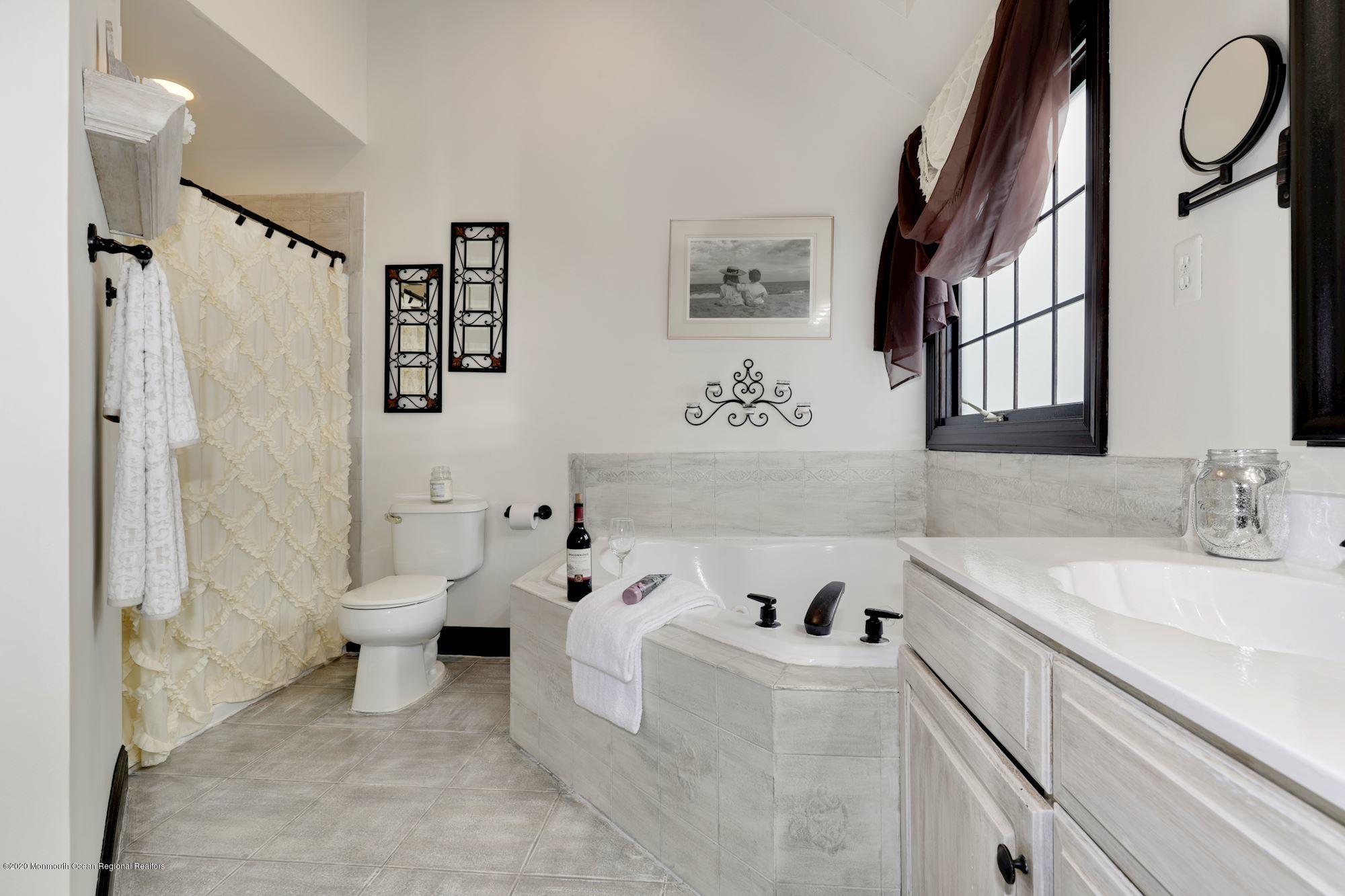 782 Harmony Road Jackson, NJ 08527 - Photo 4 of 25 a spacious bathroom with a bathtub sink and toilet