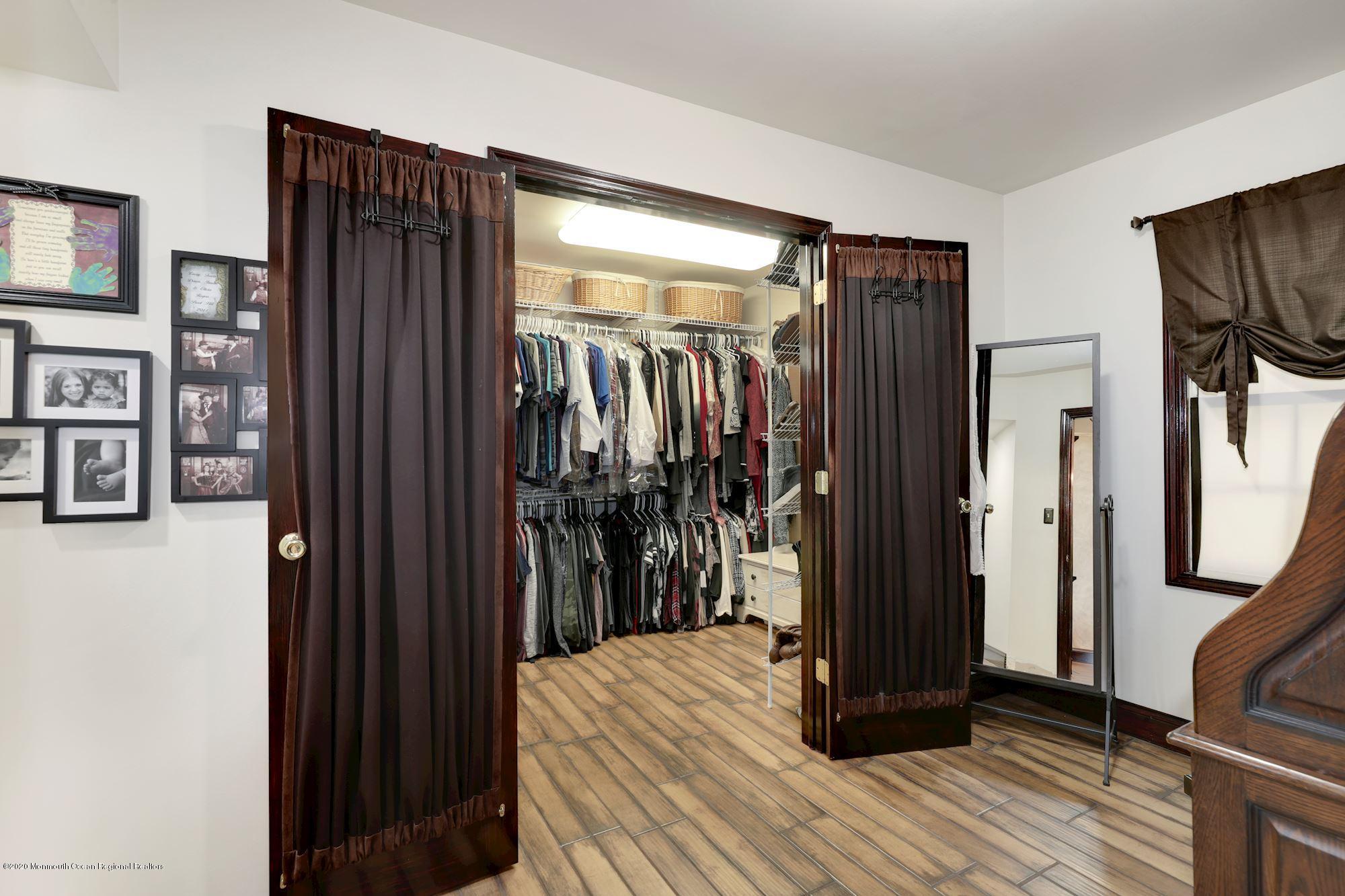 782 Harmony Road Jackson, NJ 08527 - Photo 6 of 25 a view of a hallway with closet and a window