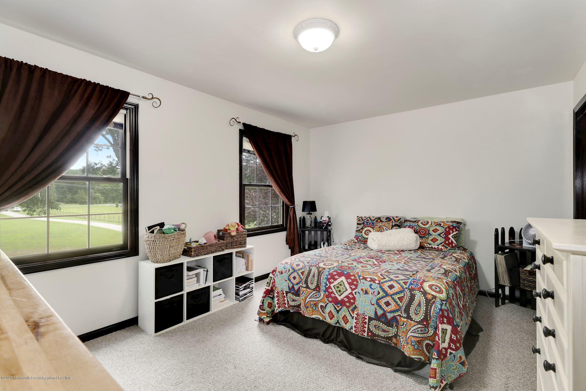 782 Harmony Road Jackson, NJ 08527 - Photo 10 of 25 a bedroom with a bed and a large window