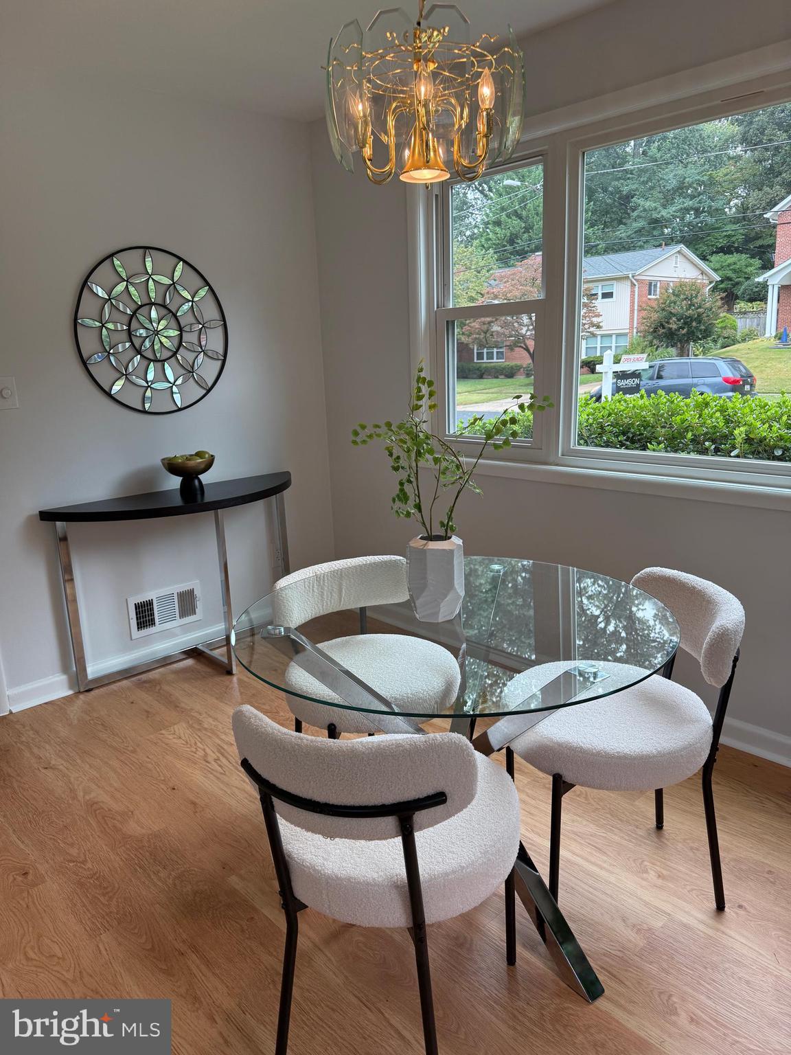 406 Waterford Road Silver Spring, MD 20901 - Photo 13 of 42 a dining room with furniture a large window and a chandelier