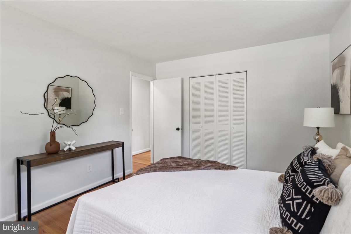 406 Waterford Road Silver Spring, MD 20901 - Photo 16 of 42 a bedroom with a bed and a mirror