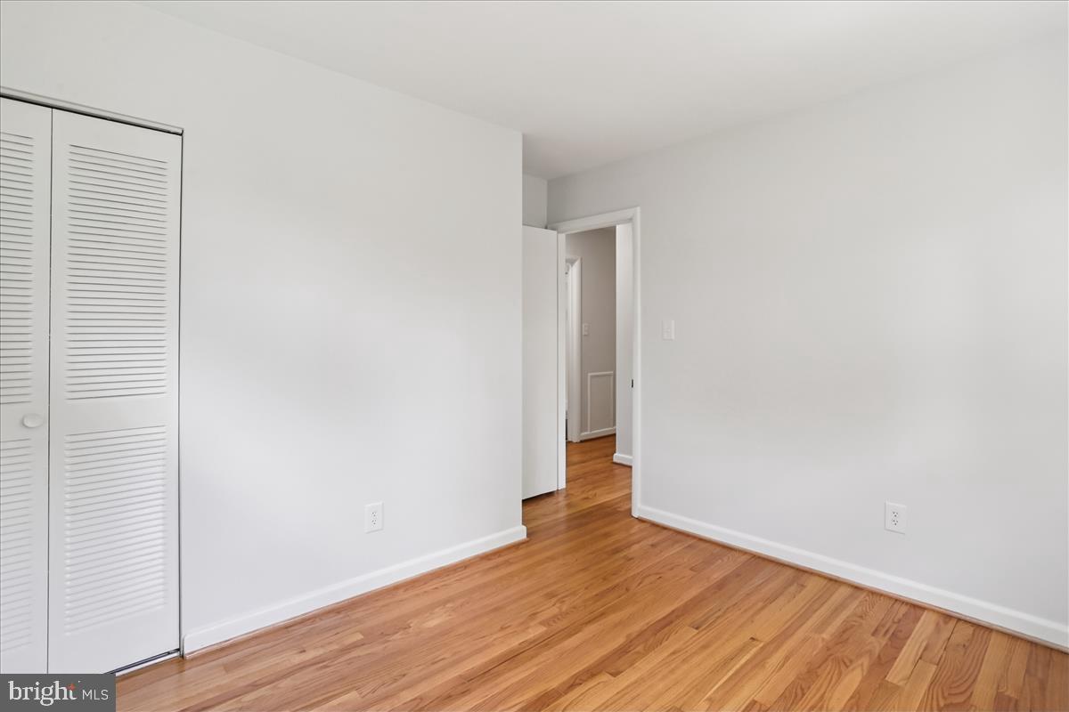 406 Waterford Road Silver Spring, MD 20901 - Photo 18 of 42 an empty room with wooden floor