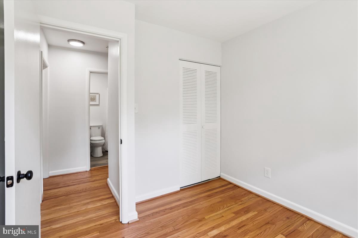 406 Waterford Road Silver Spring, MD 20901 - Photo 21 of 42 a view of a hallway with wooden floor