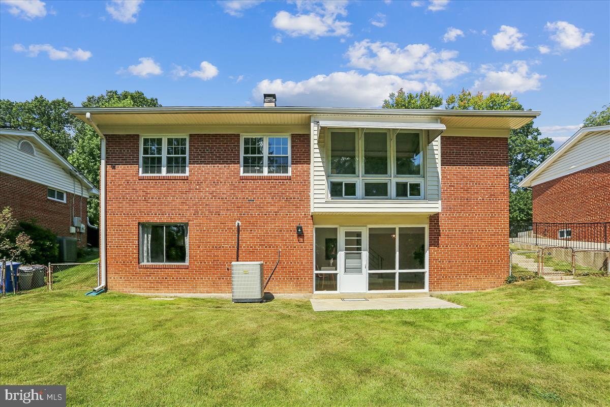 406 Waterford Road Silver Spring, MD 20901 - Photo 29 of 42 a front view of a house with a yard