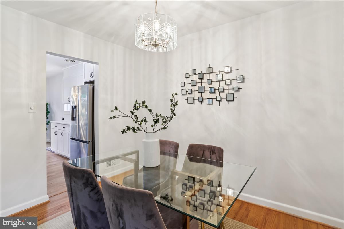 406 Waterford Road Silver Spring, MD 20901 - Photo 6 of 42 a view of a dining room with furniture and chandelier