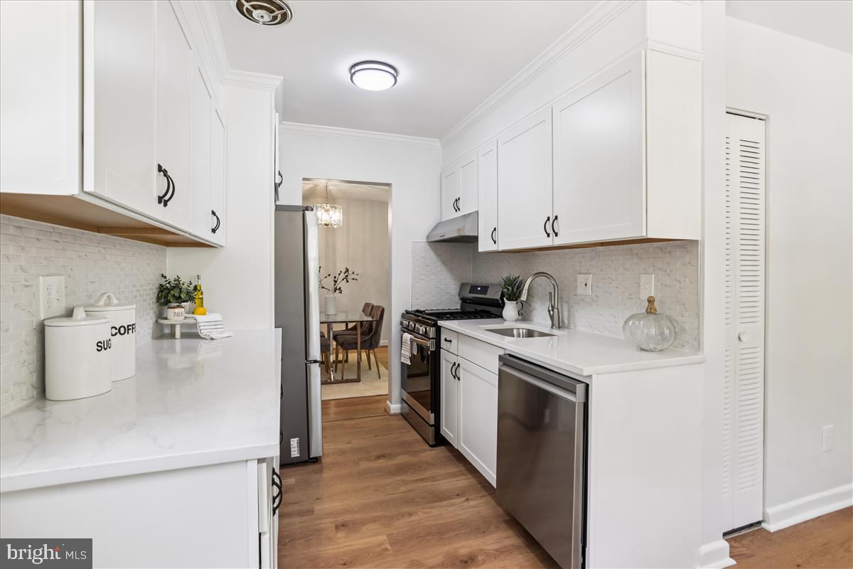 406 Waterford Road Silver Spring, MD 20901 - Photo 10 of 42 a kitchen with a sink a stove and refrigerator