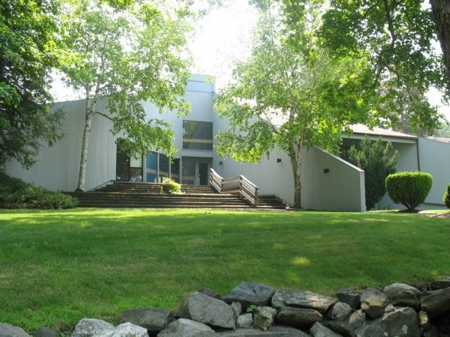 7 Dogberry Lane Ridgefield, CT 06877 - Photo 1 of 1 a front view of a house with garden