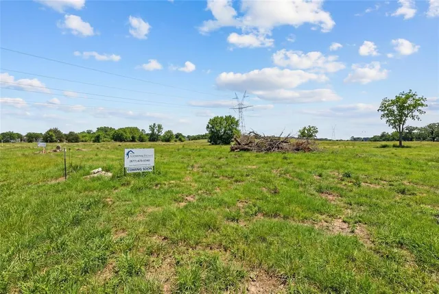 a view of a lake with houses in the back