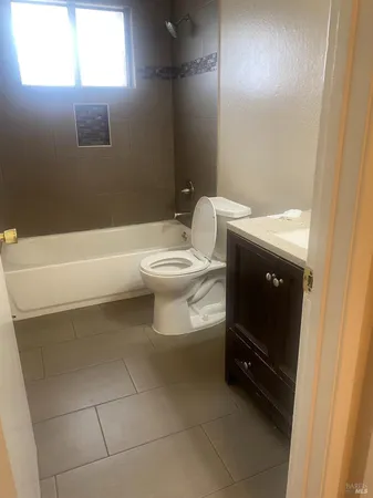 a bathroom with a toilet and a bathtub
