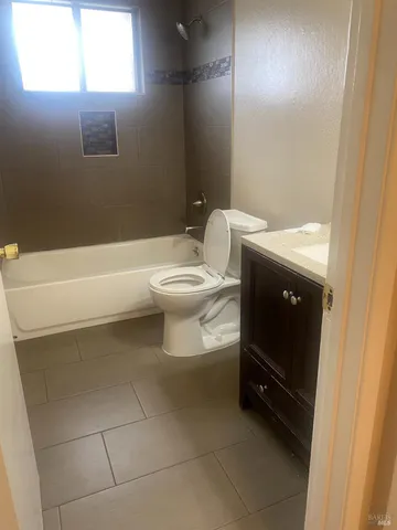a bathroom with a toilet and a bathtub