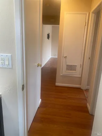a view of entryway with wooden floor