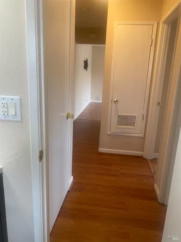 a view of entryway with wooden floor
