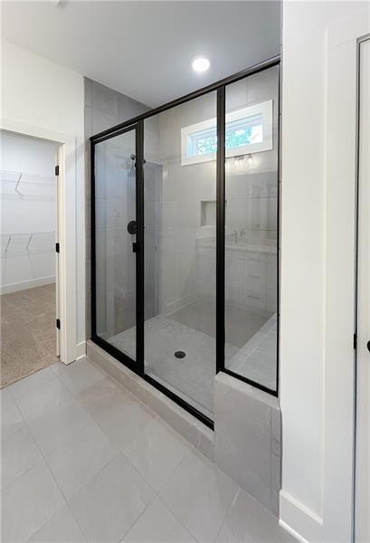 27 Bridgestone Way Cartersville, GA 30120 - Photo 27 of 31 a bathroom with a glass shower door