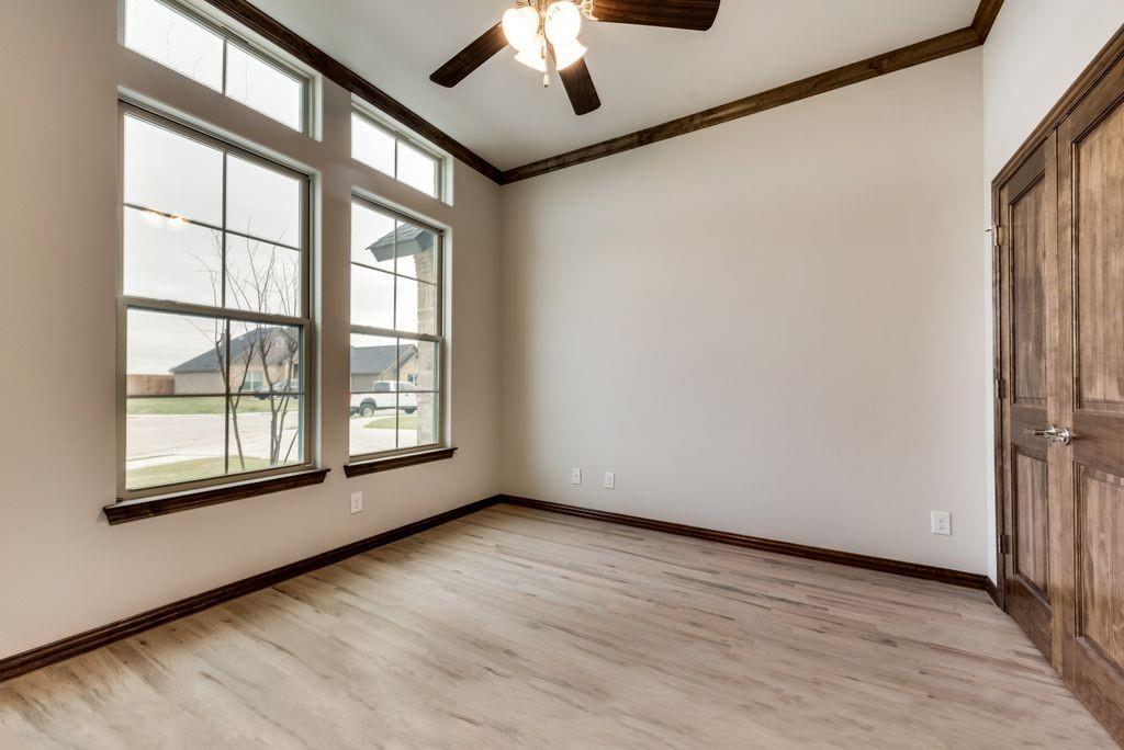 125 Katalina Lane Waxahachie, TX 75165 - Photo 16 of 34 wooden floor in an empty room with a window