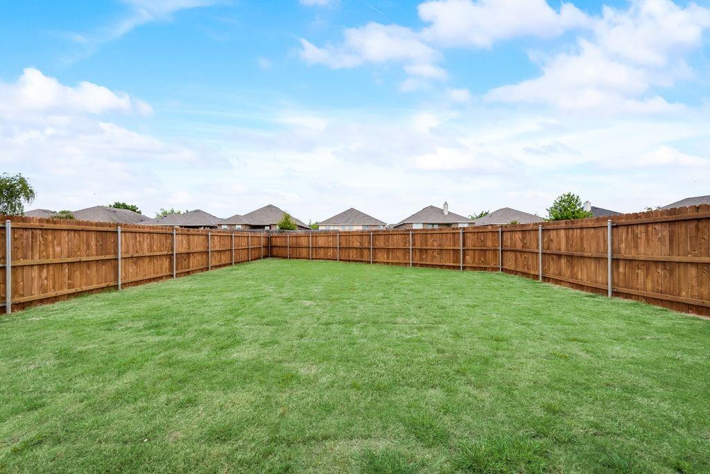 125 Katalina Lane Waxahachie, TX 75165 - Photo 2 of 34 a view of a backyard with wooden fence
