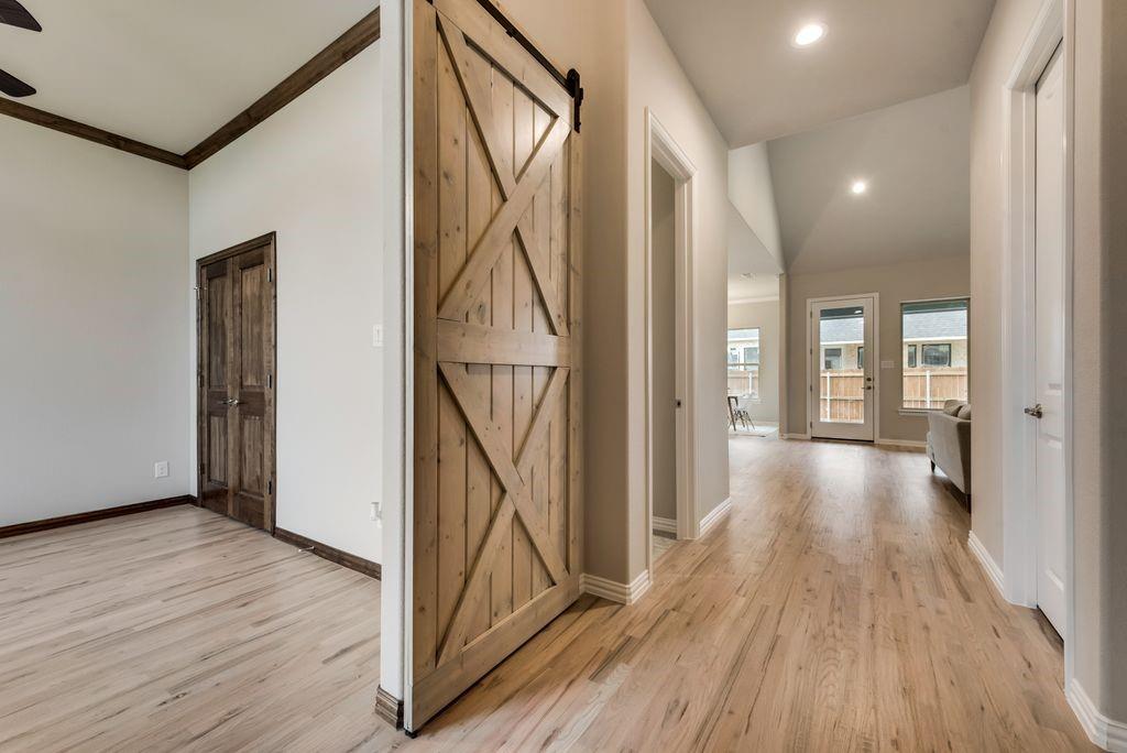 125 Katalina Lane Waxahachie, TX 75165 - Photo 5 of 34 a view of gallery with wooden floor