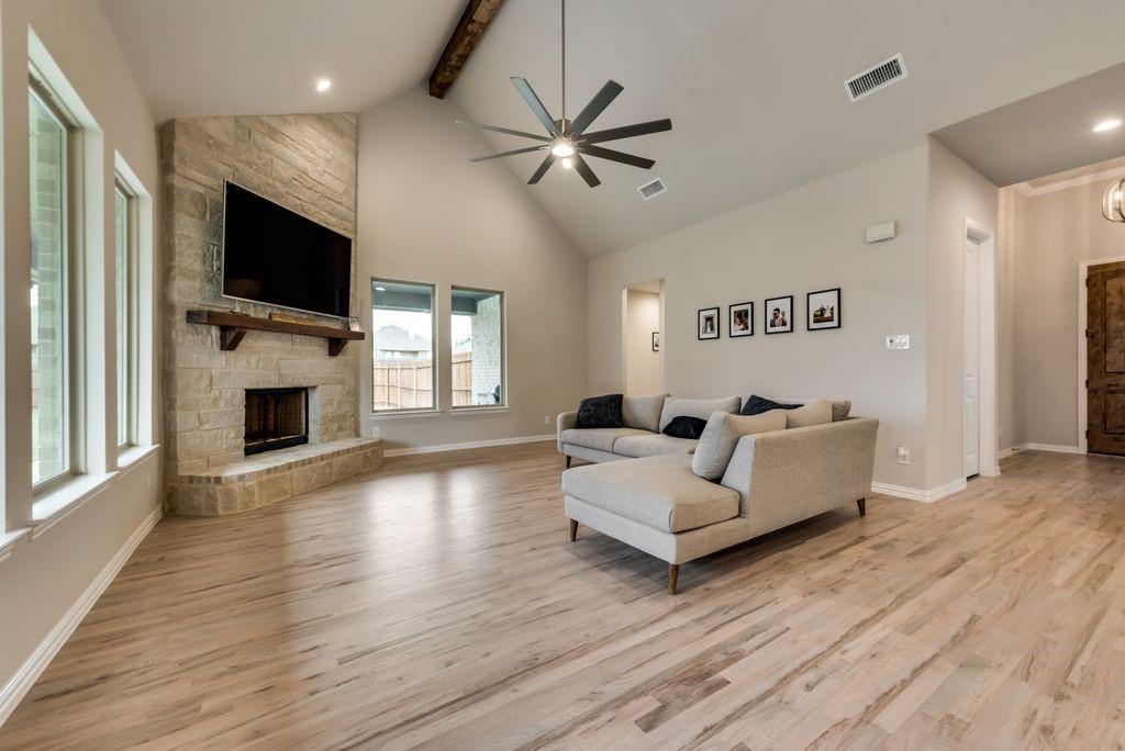 125 Katalina Lane Waxahachie, TX 75165 - Photo 8 of 34 a living room with fireplace furniture and a flat screen tv