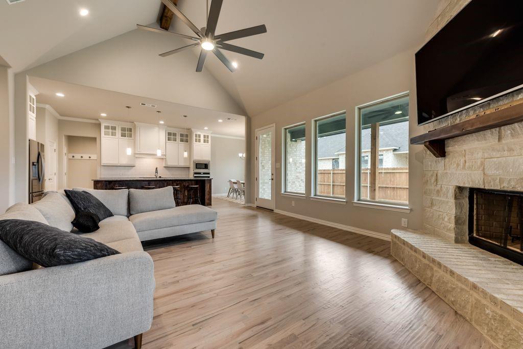 125 Katalina Lane Waxahachie, TX 75165 - Photo 9 of 34 a living room with furniture or chandelier and a fireplace