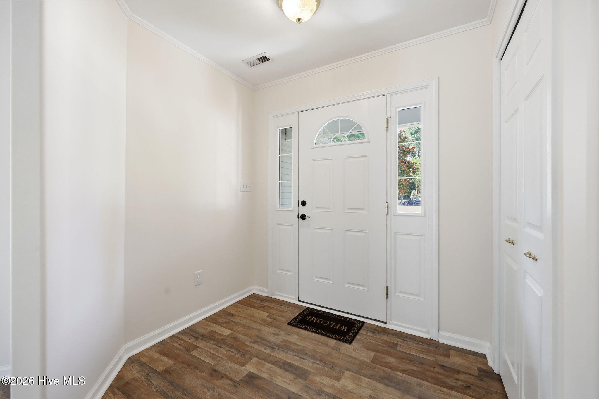 702 Hummingbird South Swansboro, NC 28584 - Photo 9 of 34 Foyer and coat closet
