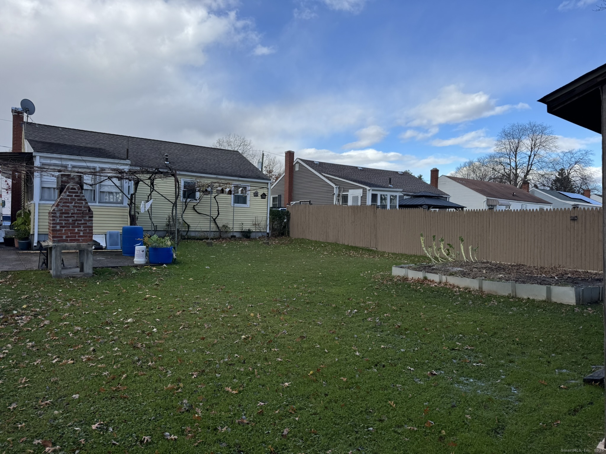 111 Harvard Street Hartford, CT 06106 - Photo 2 of 21 a view of a big yard with a house in the background