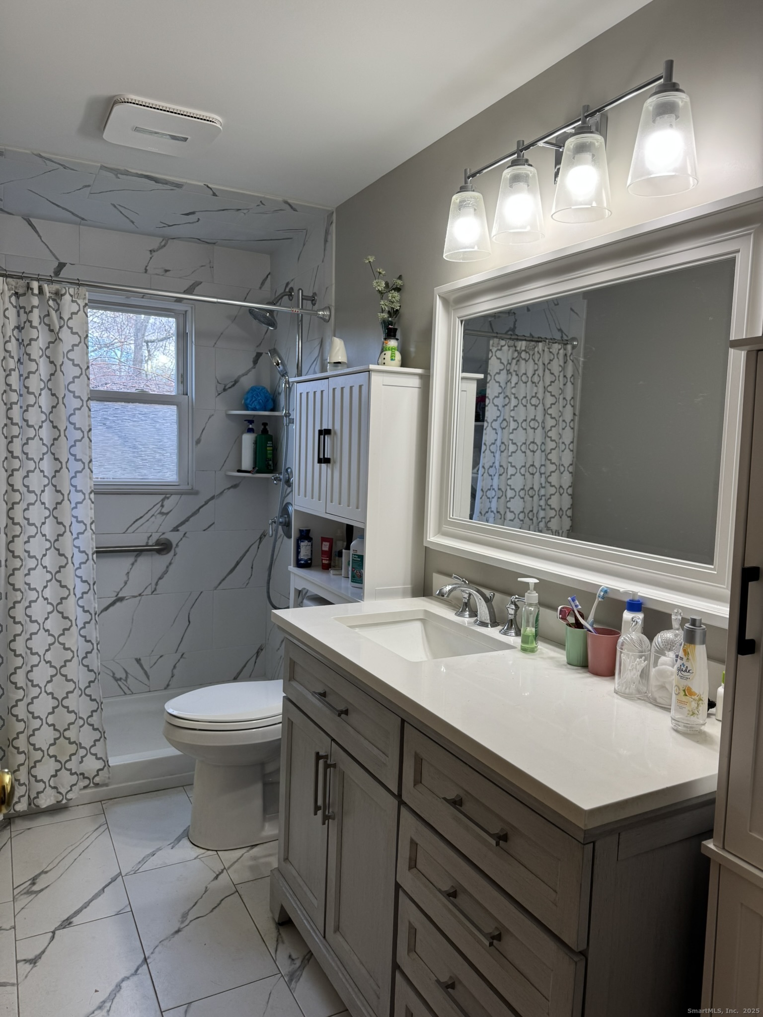 111 Harvard Street Hartford, CT 06106 - Photo 4 of 21 a bathroom with a sink toilet and mirror