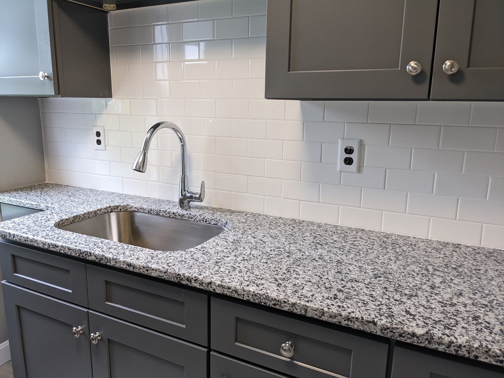 447 Warren Street Fall River, MA 02721 - Photo 3 of 20 a close view of sink and tap