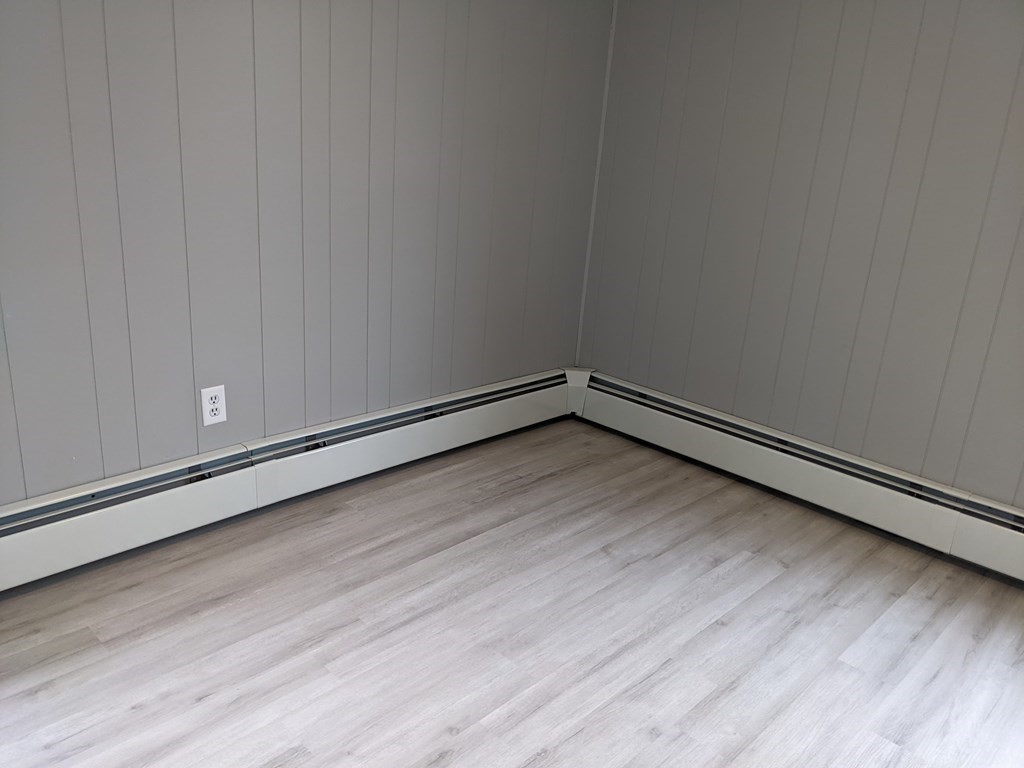 447 Warren Street Fall River, MA 02721 - Photo 6 of 20 a view of a room with wooden floor