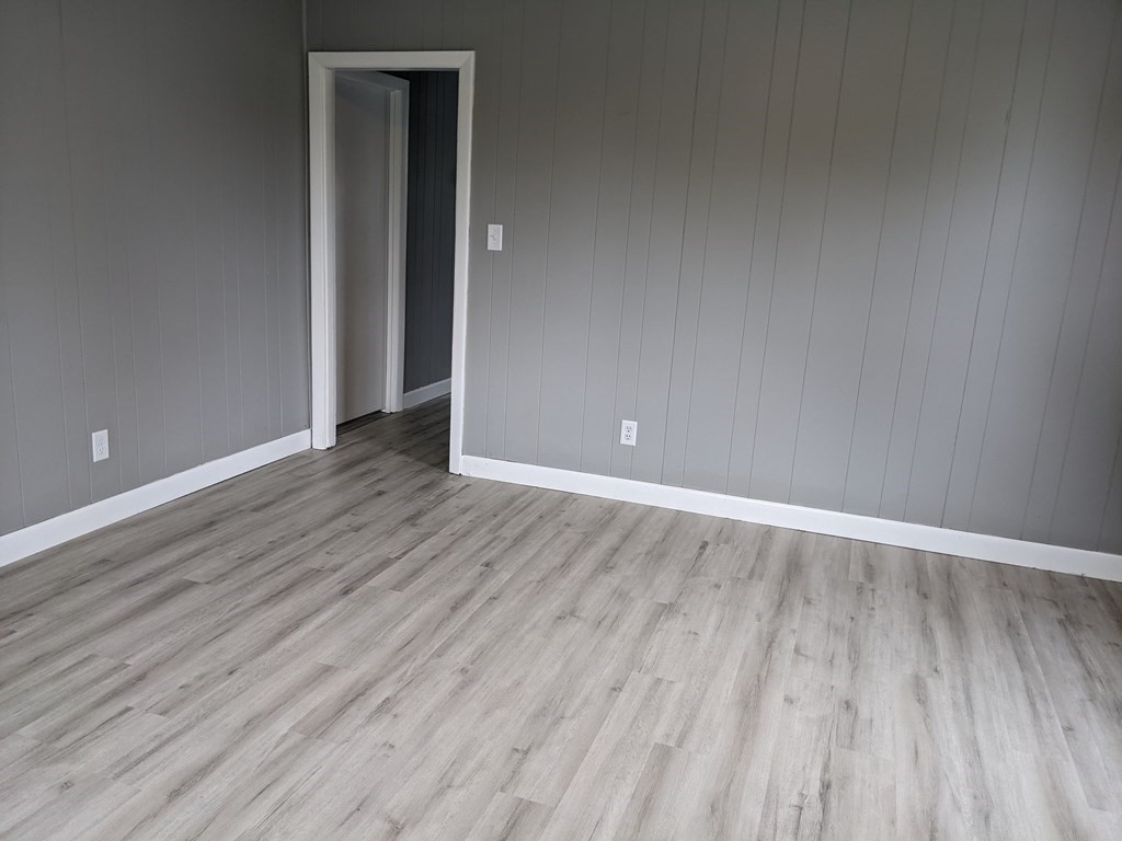 447 Warren Street Fall River, MA 02721 - Photo 8 of 20 a view of an empty room with wooden floor