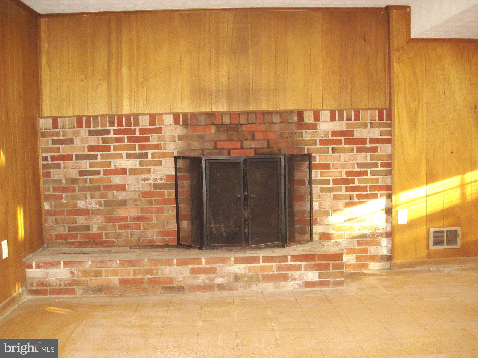 208 Rolling Road Gaithersburg, MD 20877 - Photo 16 of 26 Brick wood burning fire place Basement 2