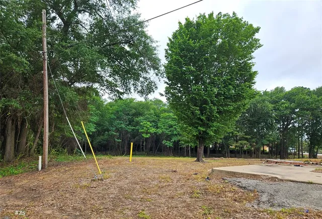 a backyard of a house with a table and chair