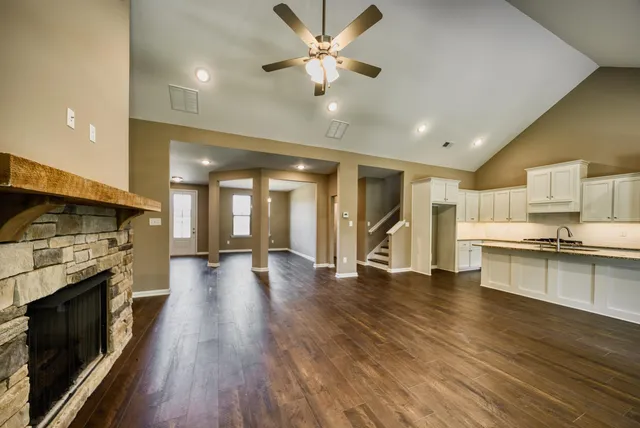 a view of a kitchen with a sink and a stove top oven