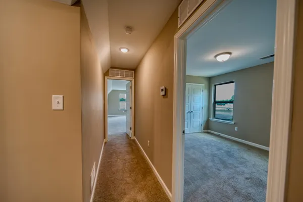 a view of hallway with livingroom