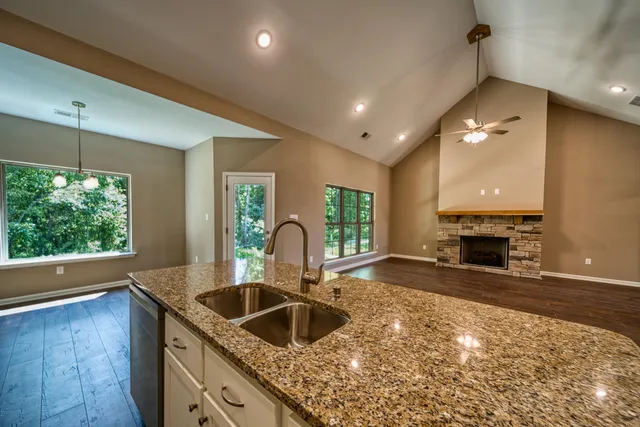 a kitchen with a sink and a stove