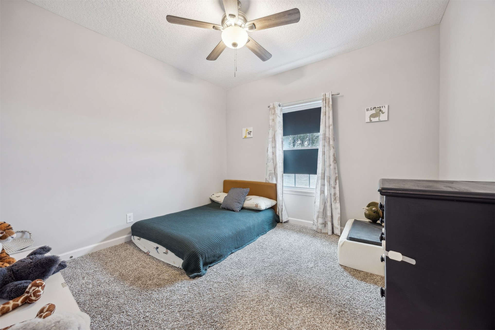 96718 Blackrock Road Yulee, FL 32097 - Photo 42 of 54 a living room with furniture and a ceiling fan