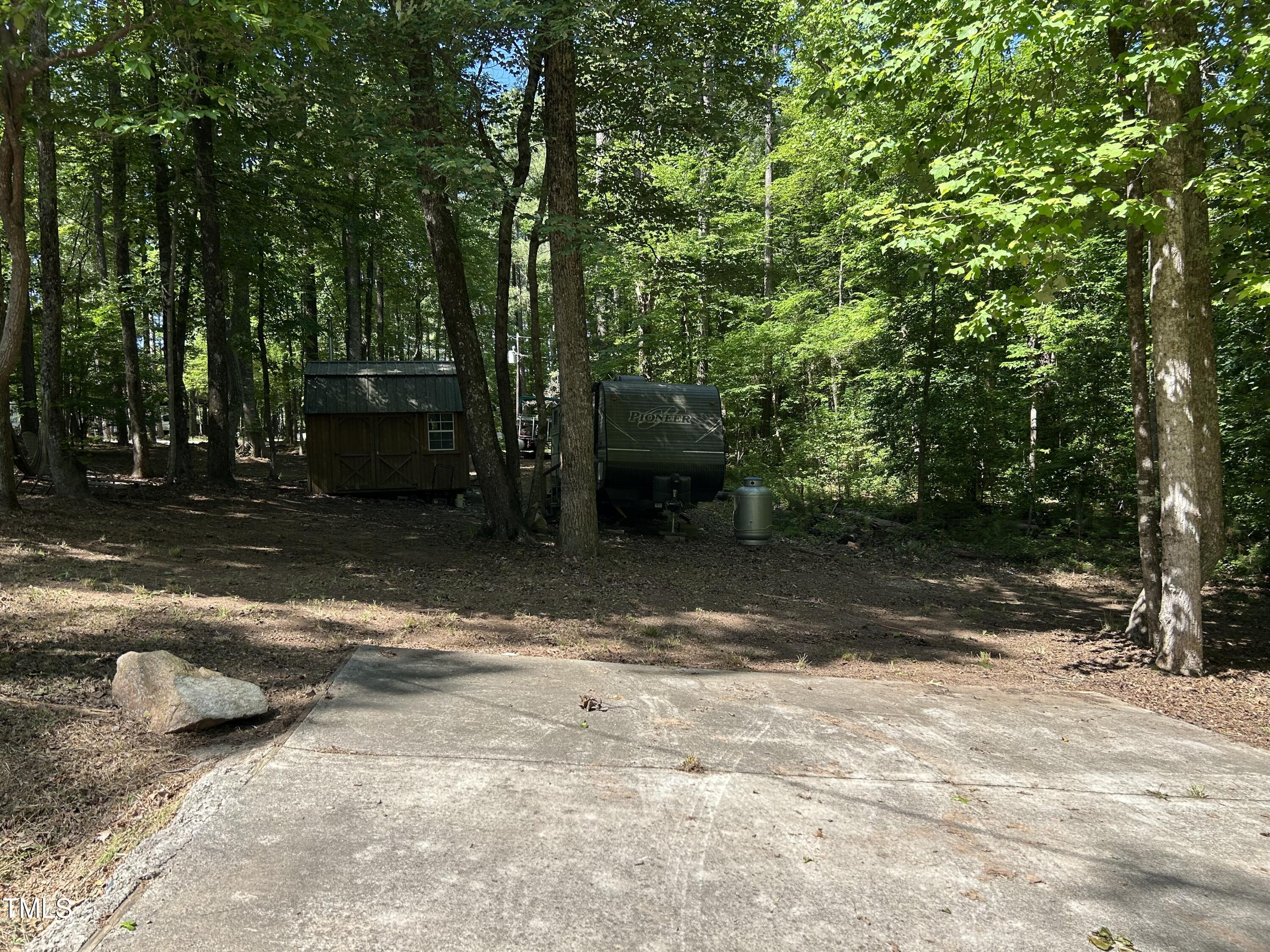123 Catoose Drive Spring Hope, NC 27882 - Photo 3 of 38 a view of a yard with large trees