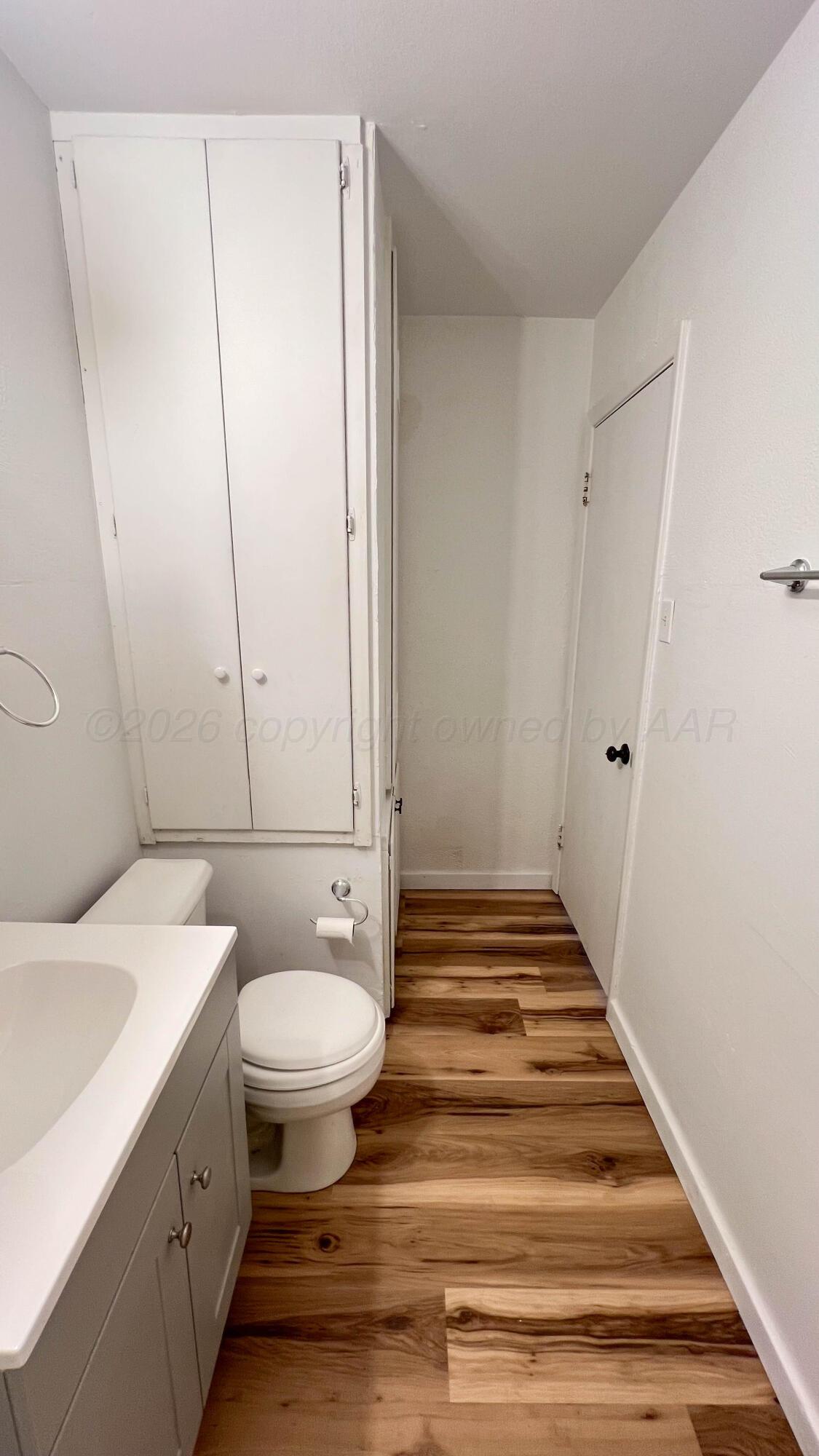 4410 South Ong Street Amarillo, TX 79110 - Photo 15 of 22 a bathroom with a sink and a mirror