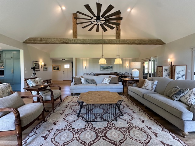 60 Meetinghouse Road Chilmark, MA 02535 - Photo 18 of 49 a living room with furniture a rug and a chandelier